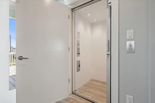 a large kitchen with a table and chairs in it