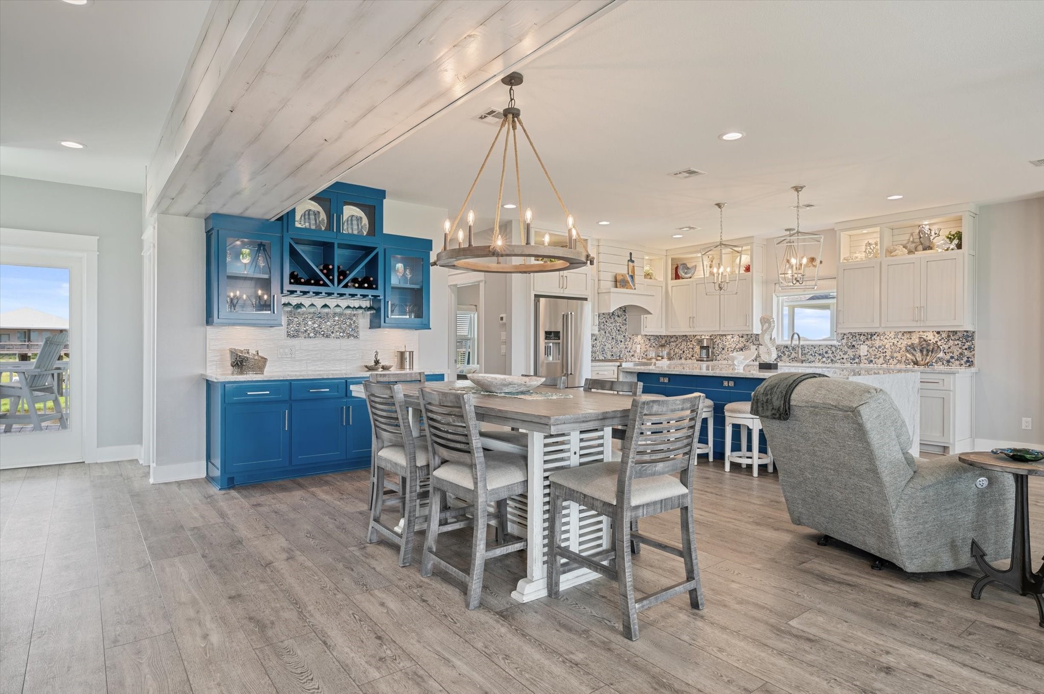 3701 Biscayne Beach Road Port Bolivar, TX 77650 - Photo 18 of 50 a dining room with furniture a chandelier and wooden floor