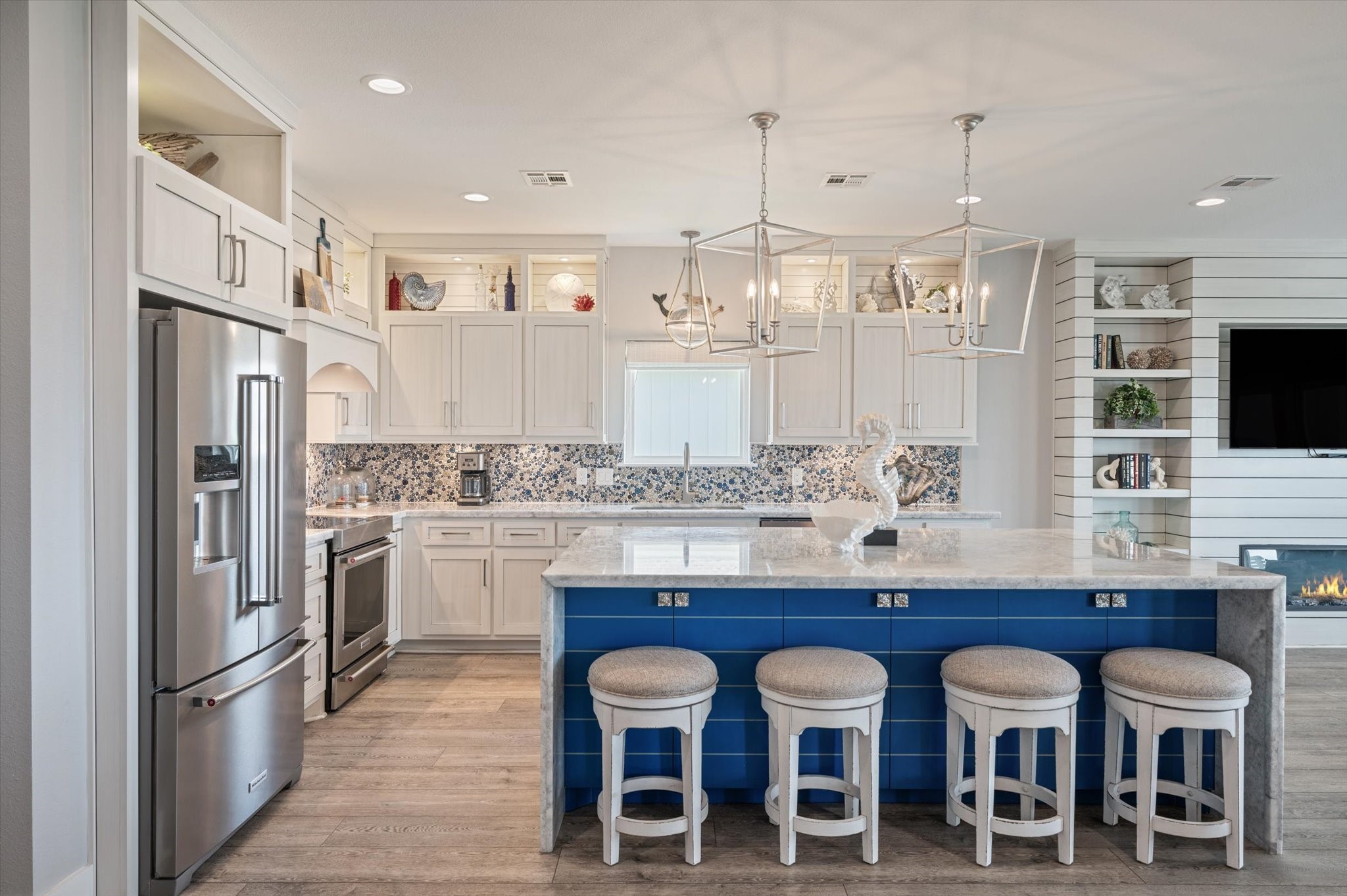 3701 Biscayne Beach Road Port Bolivar, TX 77650 - Photo 22 of 50 a kitchen with stainless steel appliances granite countertop a table chairs stove and refrigerator