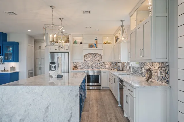 a bedroom with a bed and flat screen tv