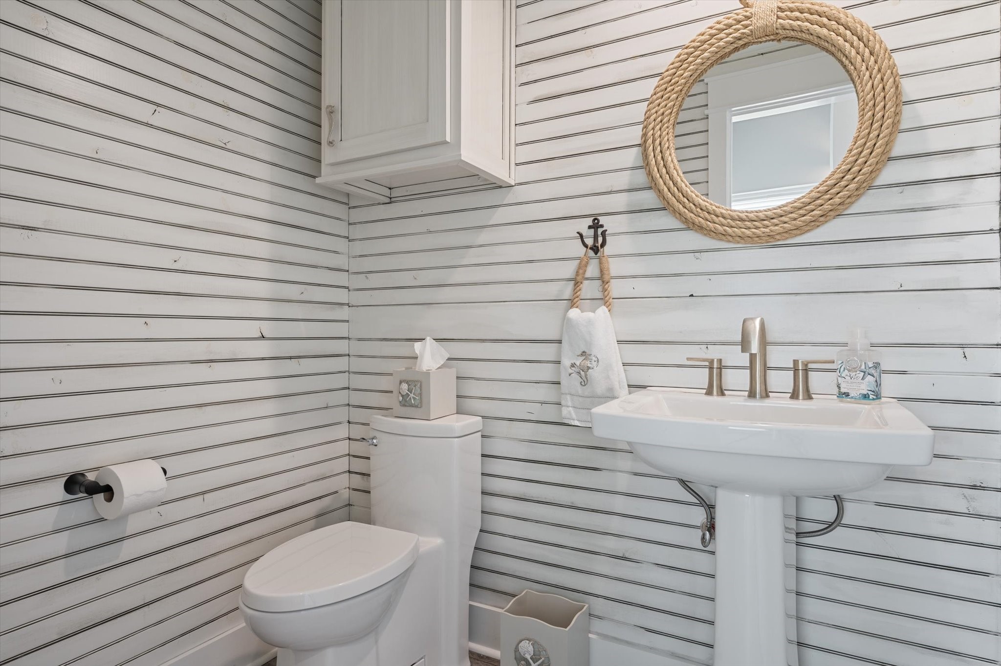 3701 Biscayne Beach Road Port Bolivar, TX 77650 - Photo 29 of 50 a bathroom with a toilet a sink and mirror