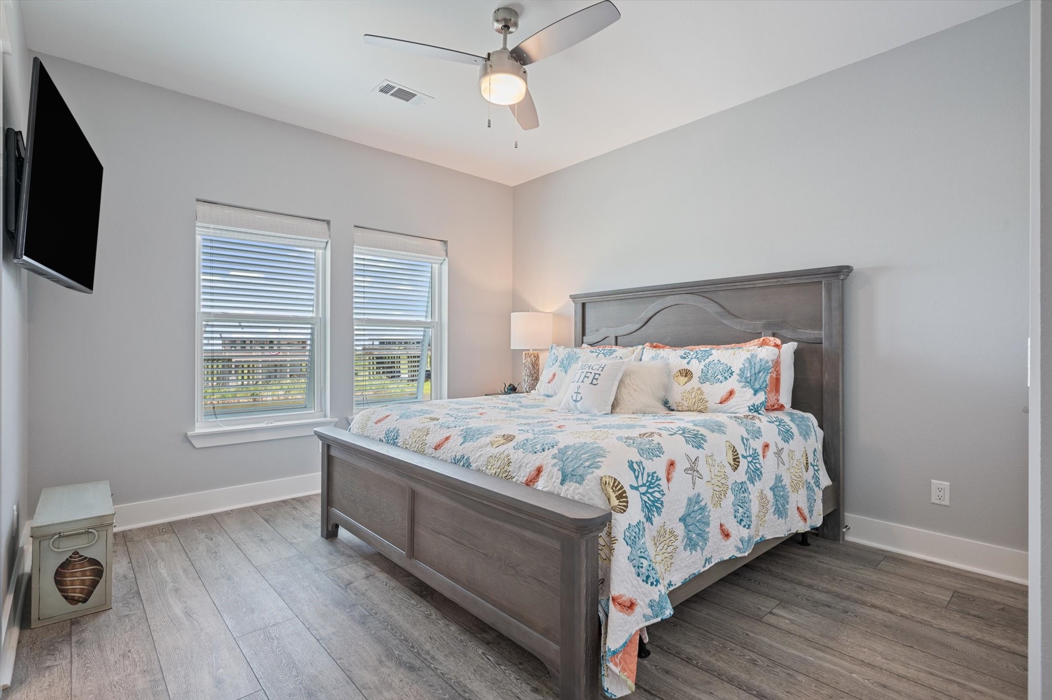 3701 Biscayne Beach Road Port Bolivar, TX 77650 - Photo 30 of 50 a bedroom with a bed a flat screen tv and a window