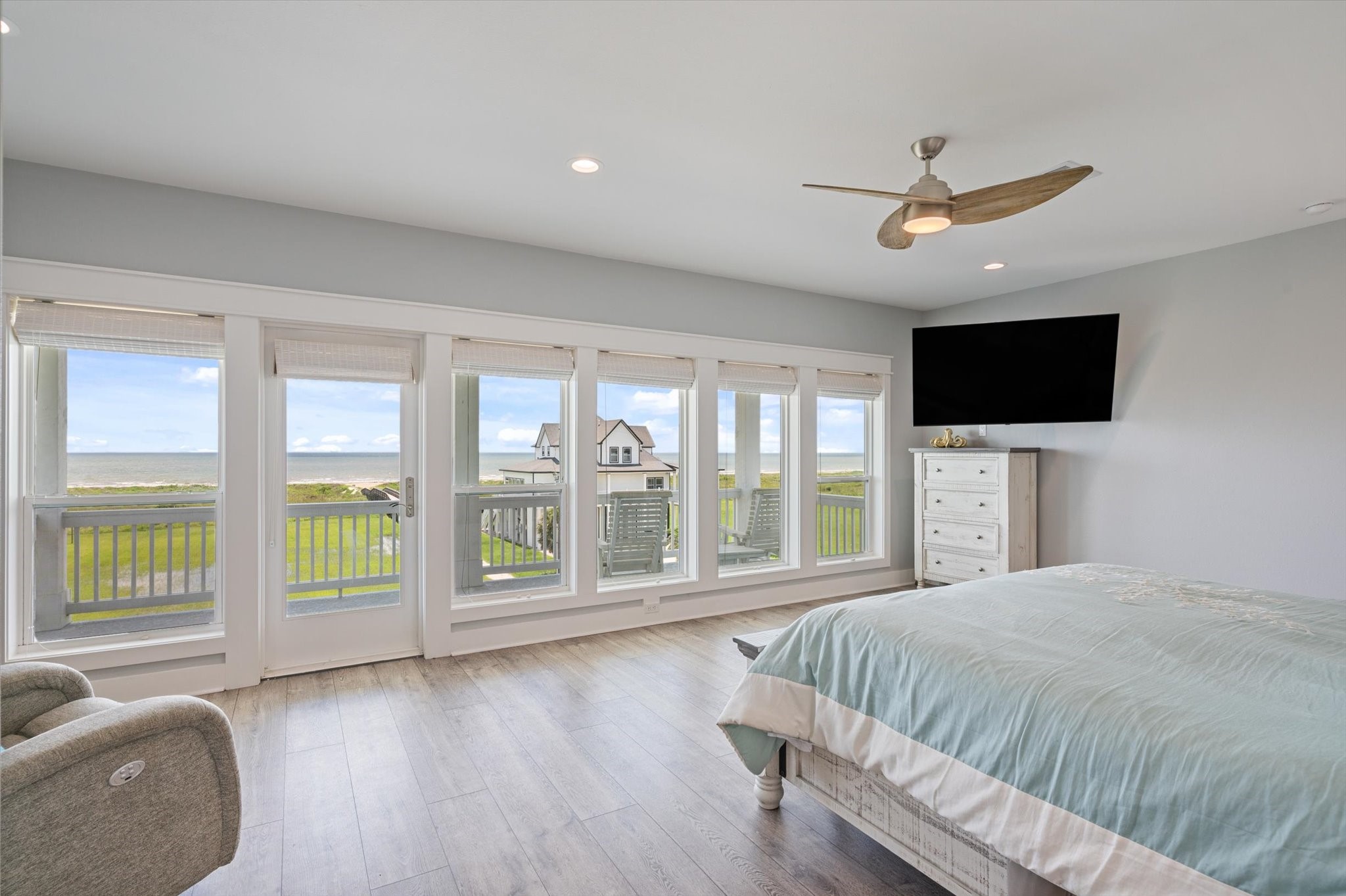 3701 Biscayne Beach Road Port Bolivar, TX 77650 - Photo 33 of 50 a spacious bedroom with a large bed and a flat tv screen