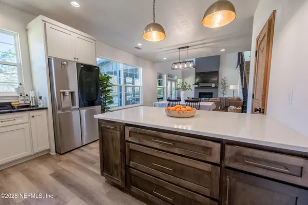 a view of a kitchen from the hallway