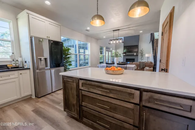 a view of a kitchen from the hallway