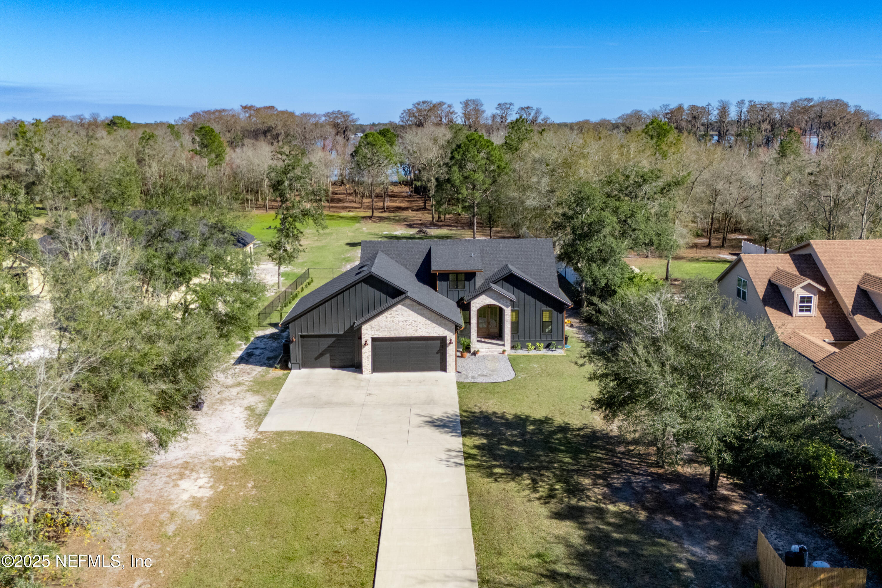 10435 Southwest 80th Place Hampton, FL 32044 - Photo 2 of 57 a view of a house with a yard