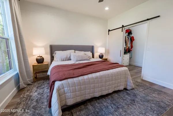 a bathroom with a double vanity sink a and a mirror