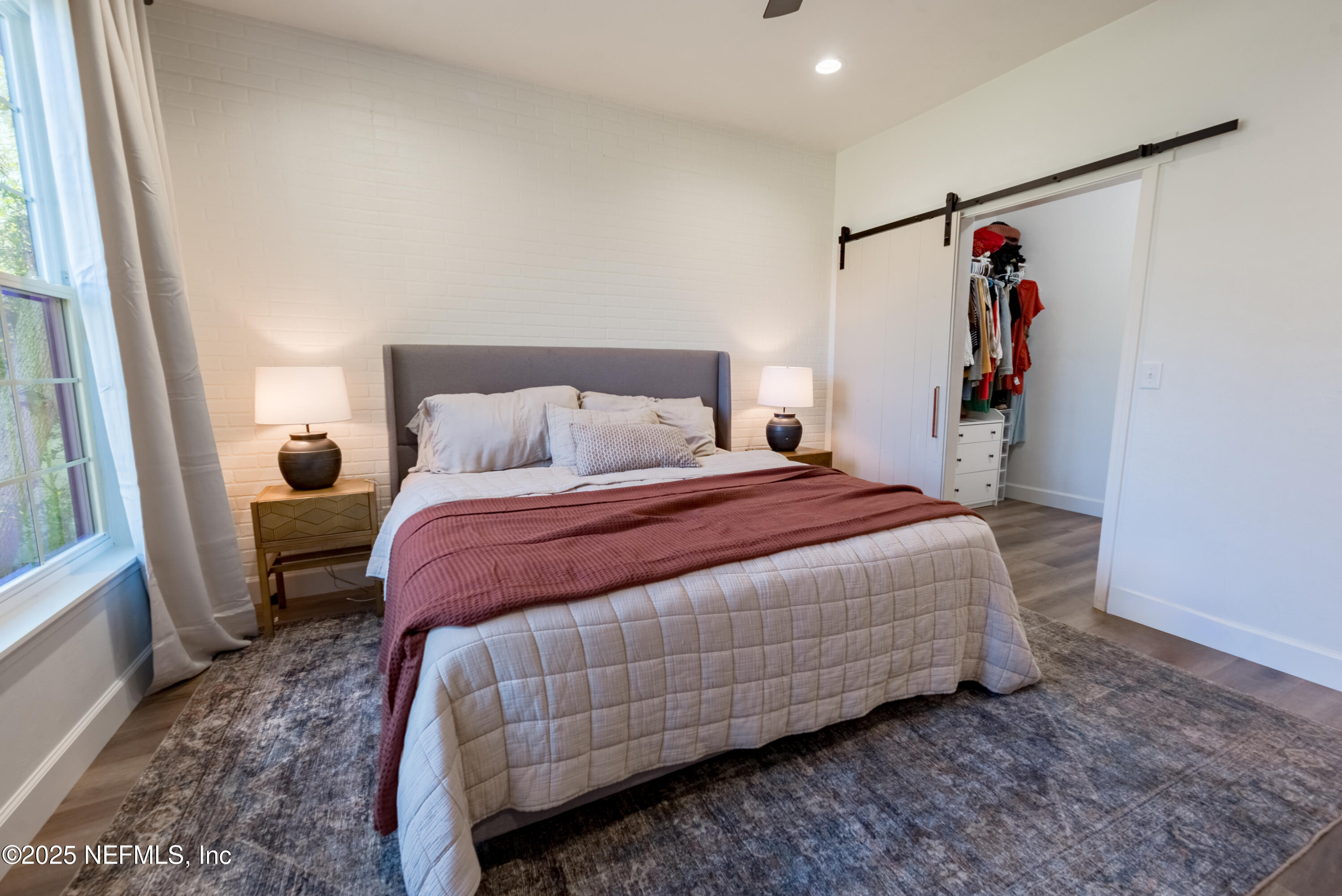 10435 Southwest 80th Place Hampton, FL 32044 - Photo 29 of 57 a bedroom with a bed and a mirror