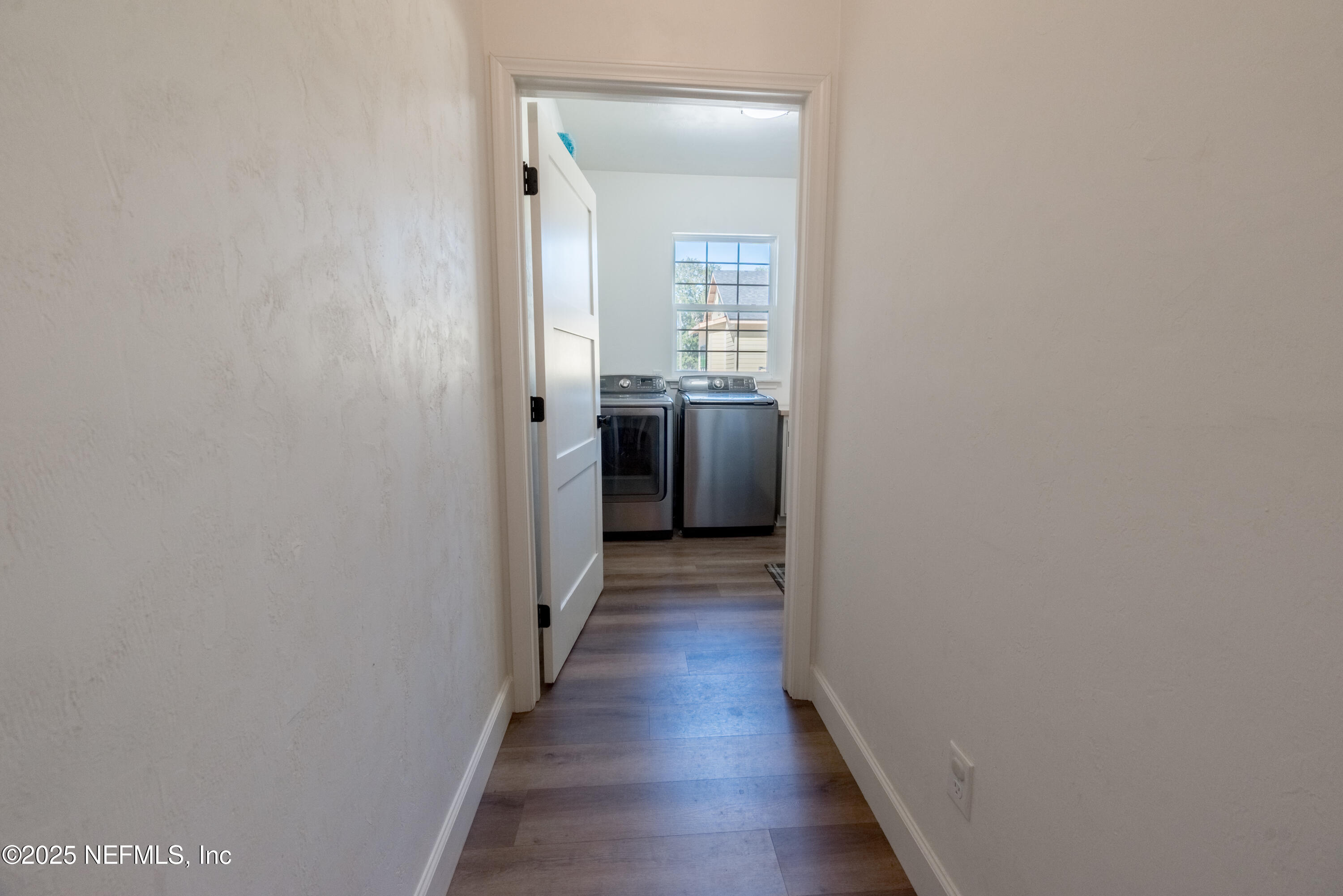10435 Southwest 80th Place Hampton, FL 32044 - Photo 34 of 57 a view of a hallway with wooden floor and a living room