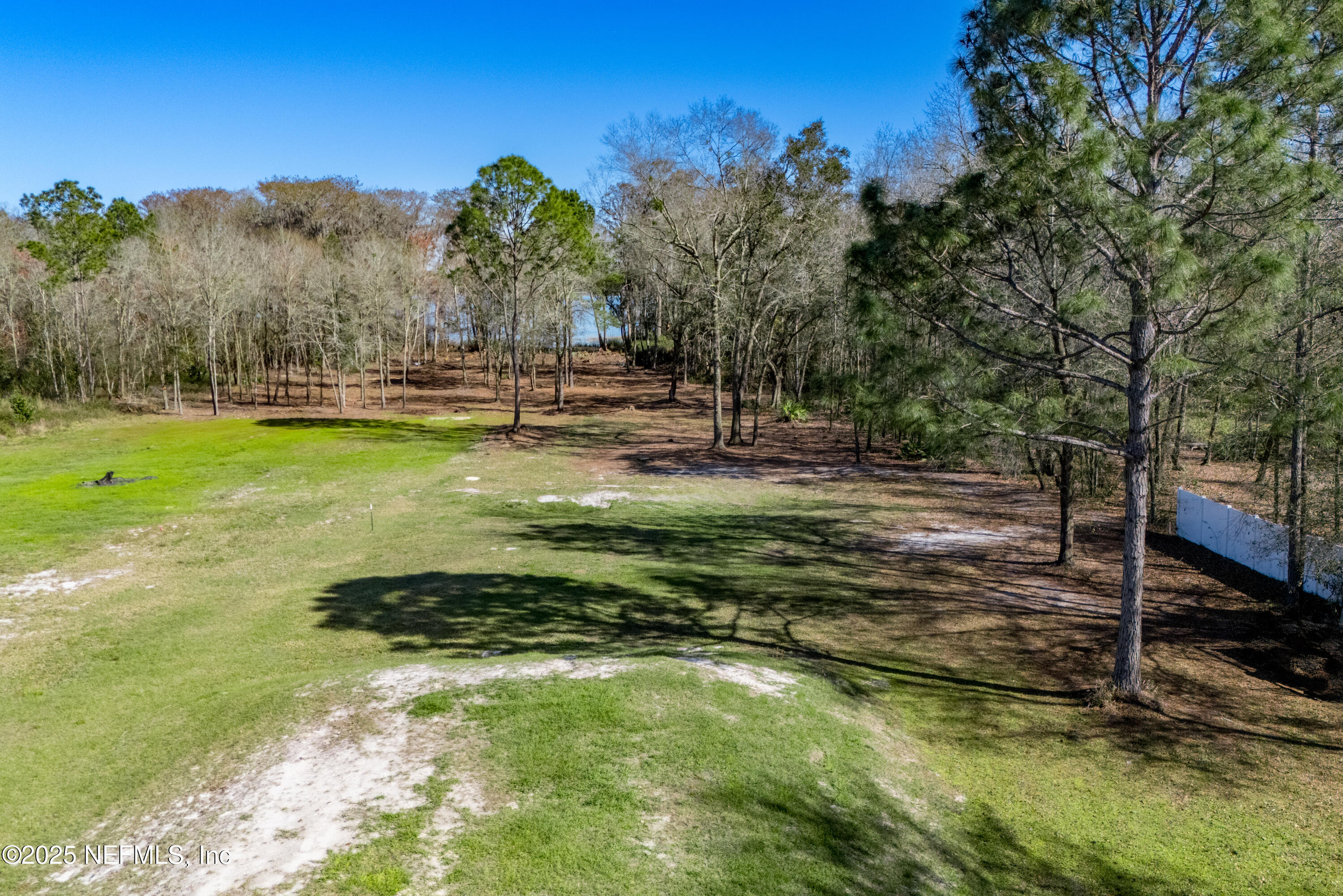 10435 Southwest 80th Place Hampton, FL 32044 - Photo 50 of 57 a backyard of a house with lots of green space