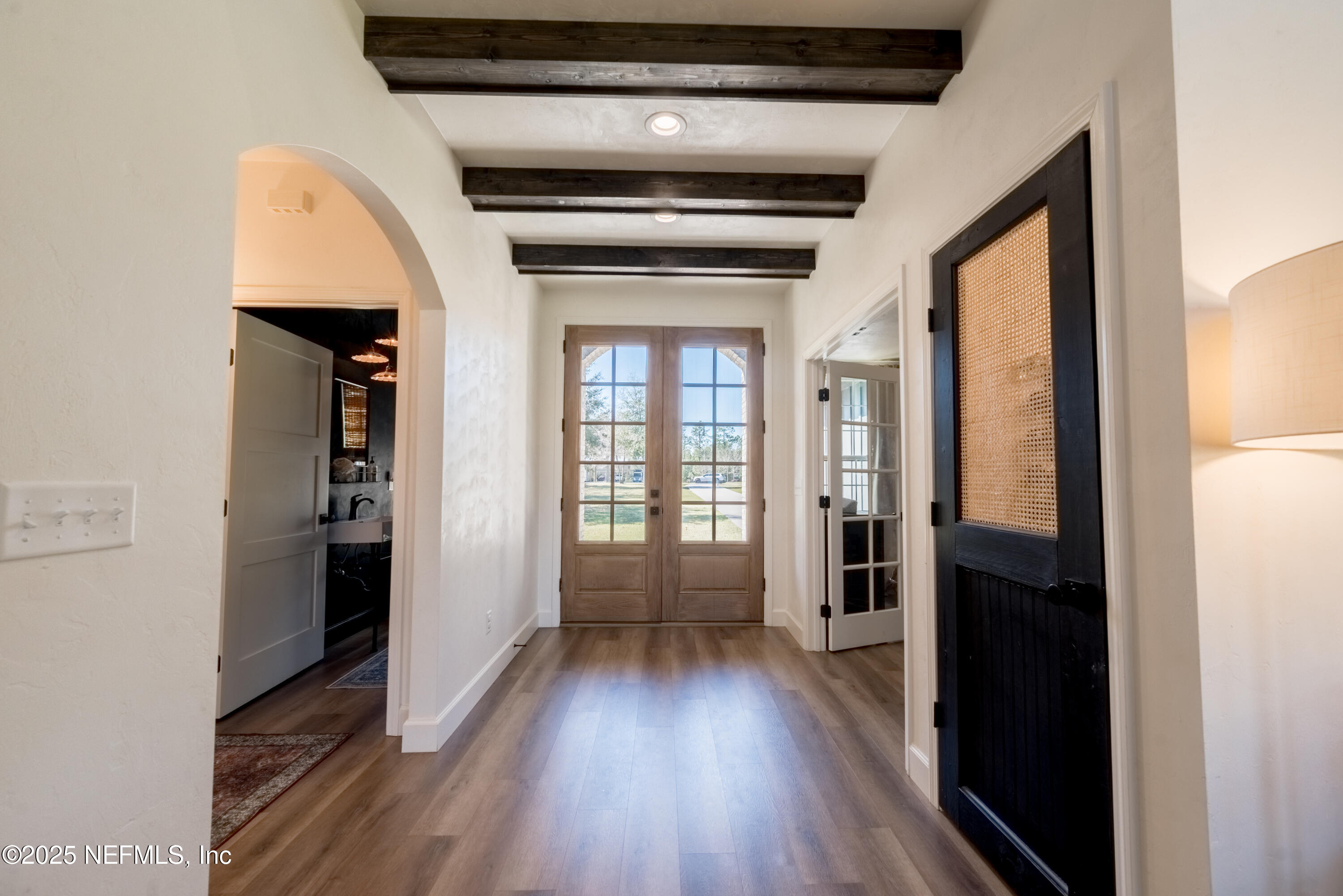 10435 Southwest 80th Place Hampton, FL 32044 - Photo 7 of 57 a view of hallway with wooden floor and stairs