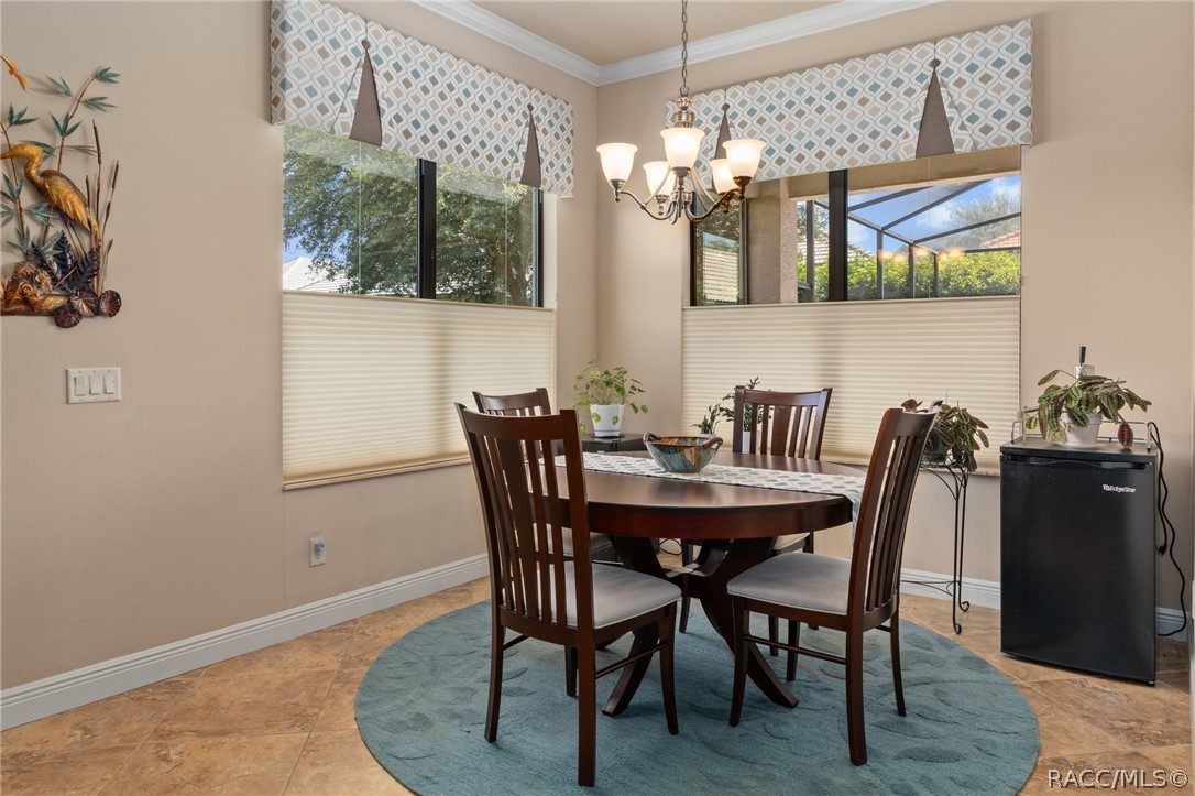 2015 North Rhodes Point Hernando, FL 34442 - Photo 16 of 82 The Dining Area is nestled within its own alcove off the Kitchen and Great Room. The Hunter Douglas pleated shades are Top Down/Bottom Up add versatility to let natural light in, while maintaining privacy.