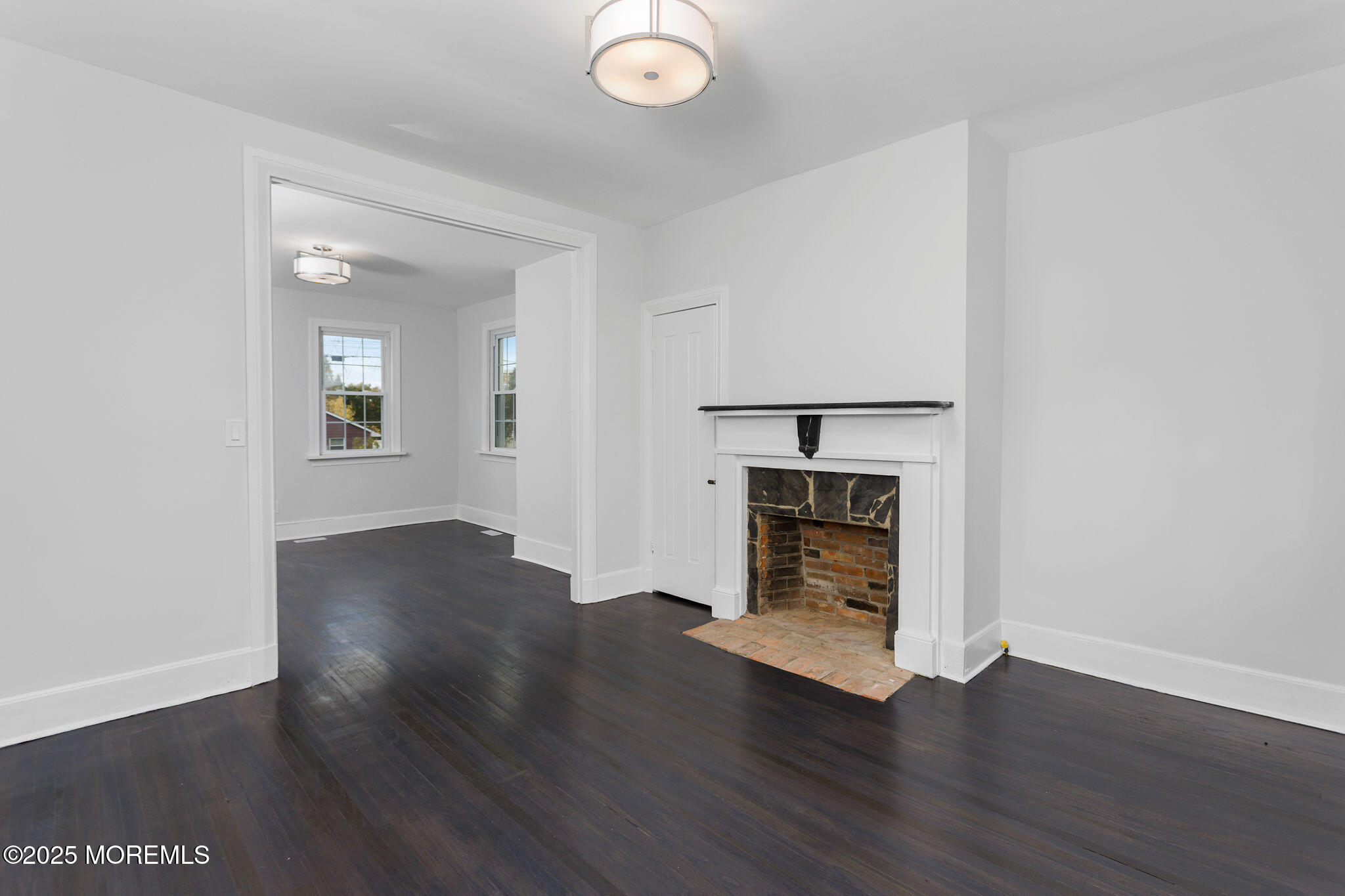 36 Chest-Georgetown Road Columbus, NJ 08022 - Photo 14 of 56 an empty room with wooden floor fire place and windows