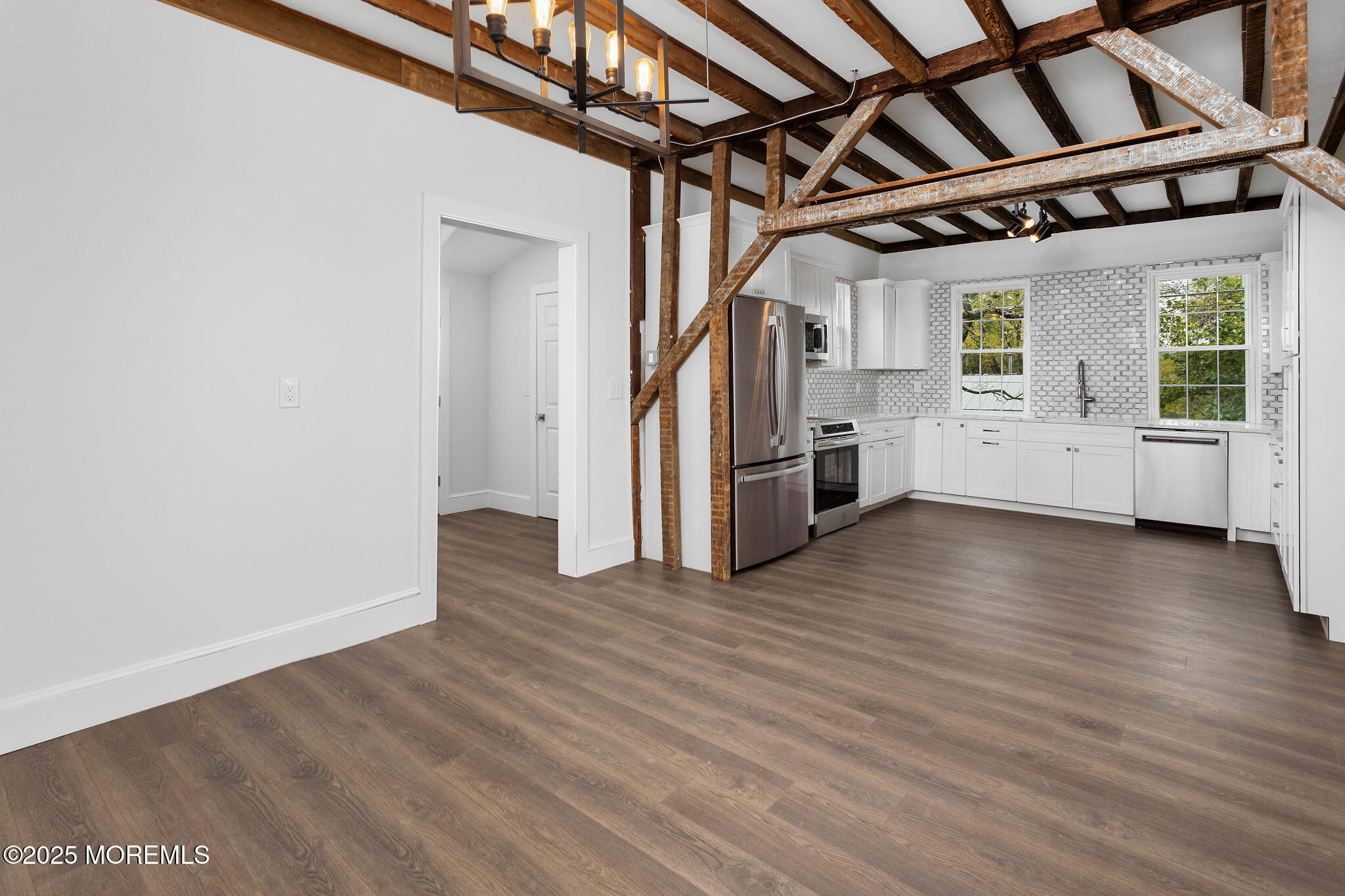 36 Chest-Georgetown Road Columbus, NJ 08022 - Photo 17 of 56 a view of an empty room with wooden floor and a window