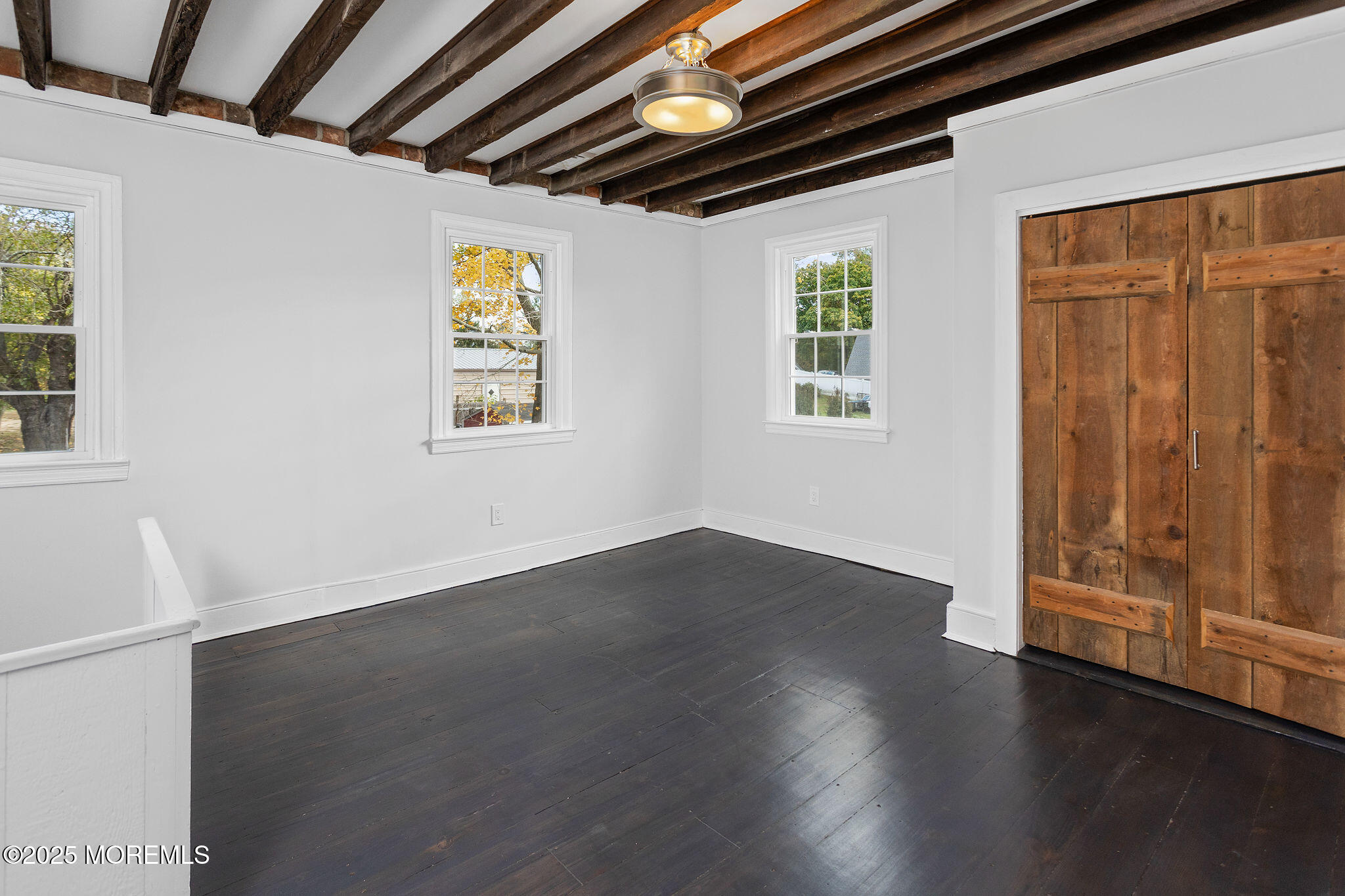 36 Chest-Georgetown Road Columbus, NJ 08022 - Photo 32 of 56 a view of an empty room with wooden floor and a window