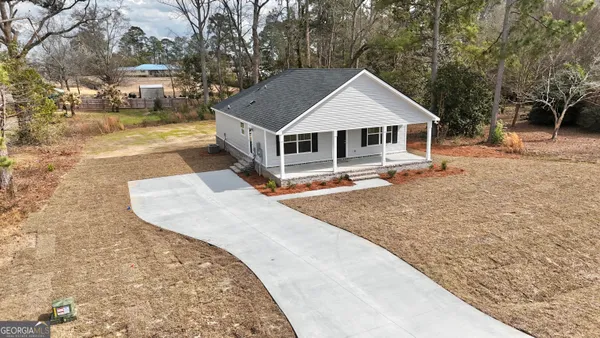 a house with trees in the background