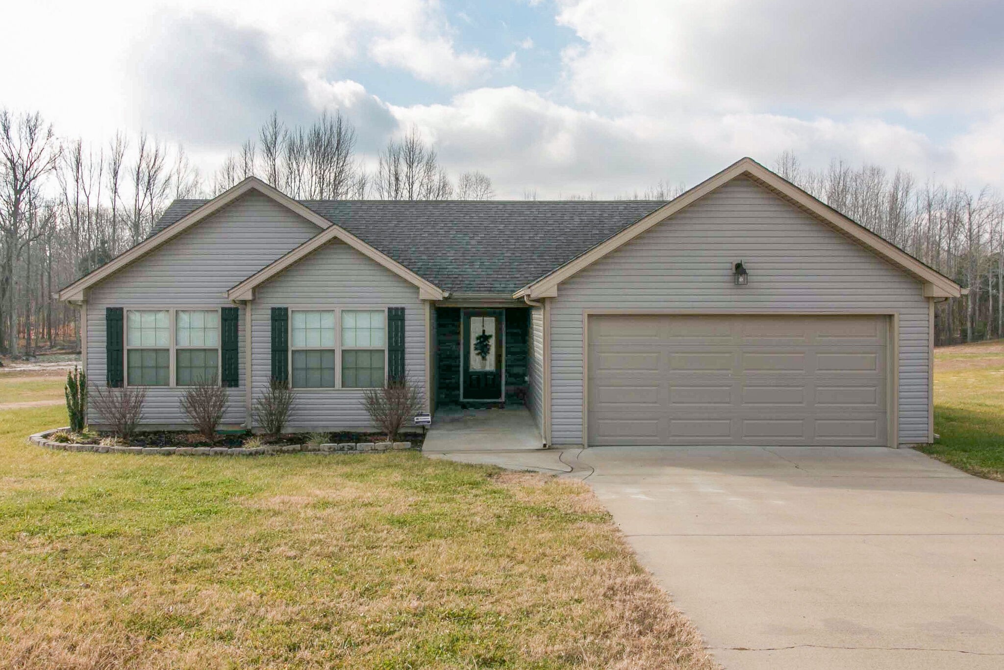 2312 River Road Clarksville, TN 37040 - Photo 1 of 25 a front view of a house with a yard and garage
