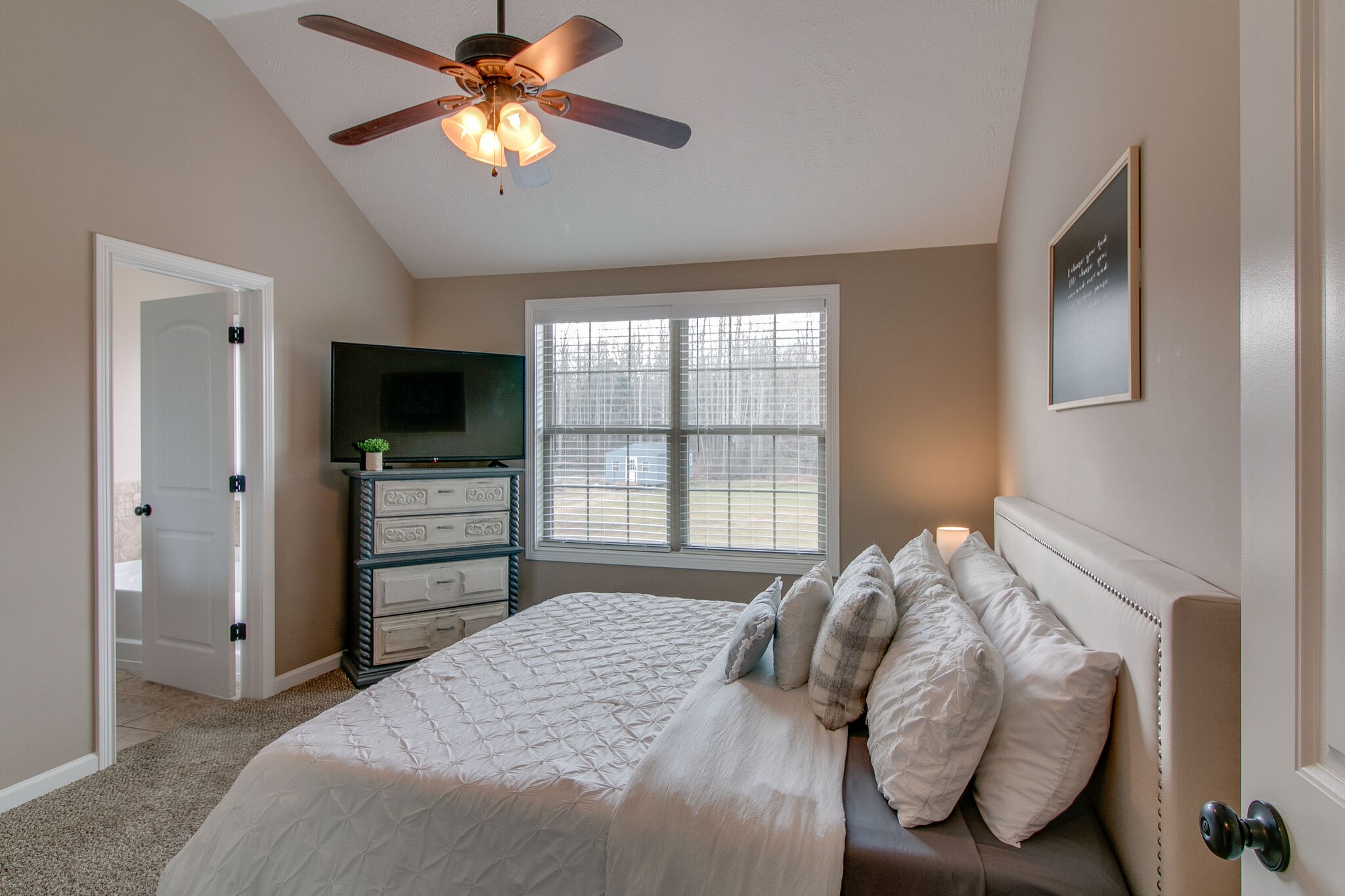 2312 River Road Clarksville, TN 37040 - Photo 14 of 25 a bedroom with bed and a chandelier