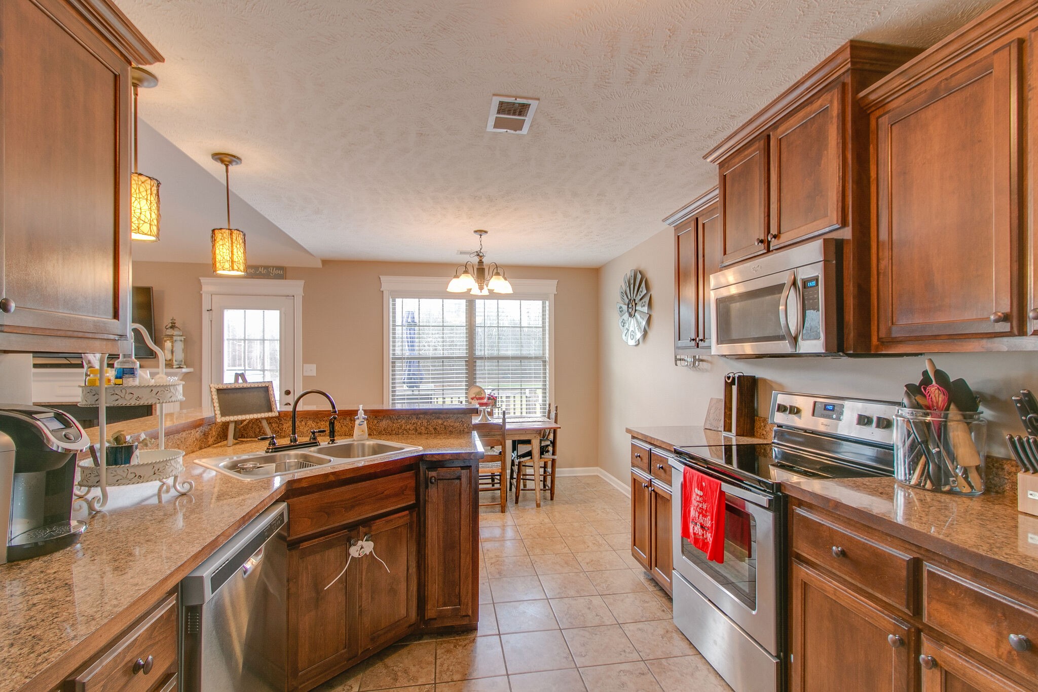 2312 River Road Clarksville, TN 37040 - Photo 16 of 25 a kitchen with stainless steel appliances granite countertop a sink and a stove
