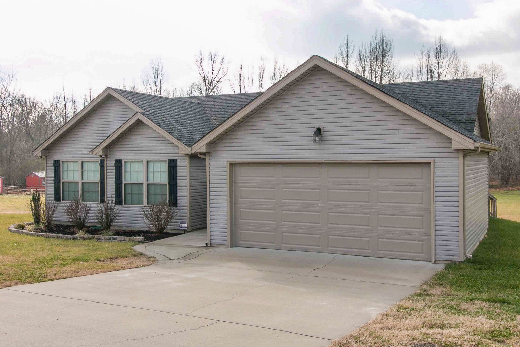 2312 River Road Clarksville, TN 37040 - Photo 23 of 25 a front view of a house with a yard and garage