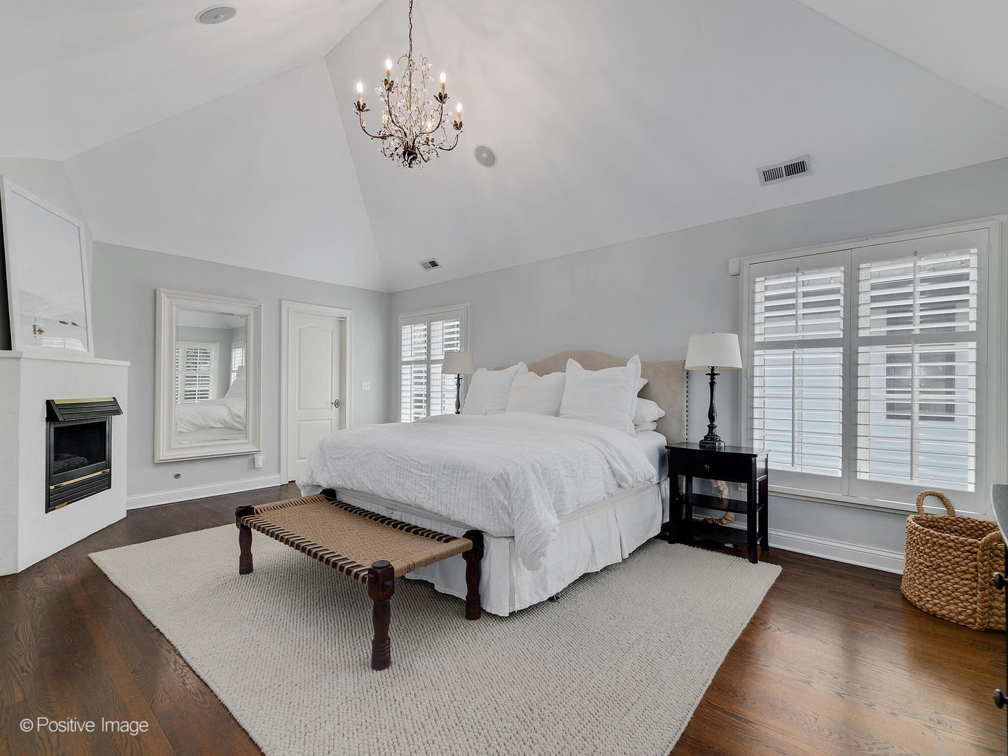 308 North County Line Road Hinsdale, IL 60521 - Photo 25 of 40 a spacious bedroom with a bed and a chandelier