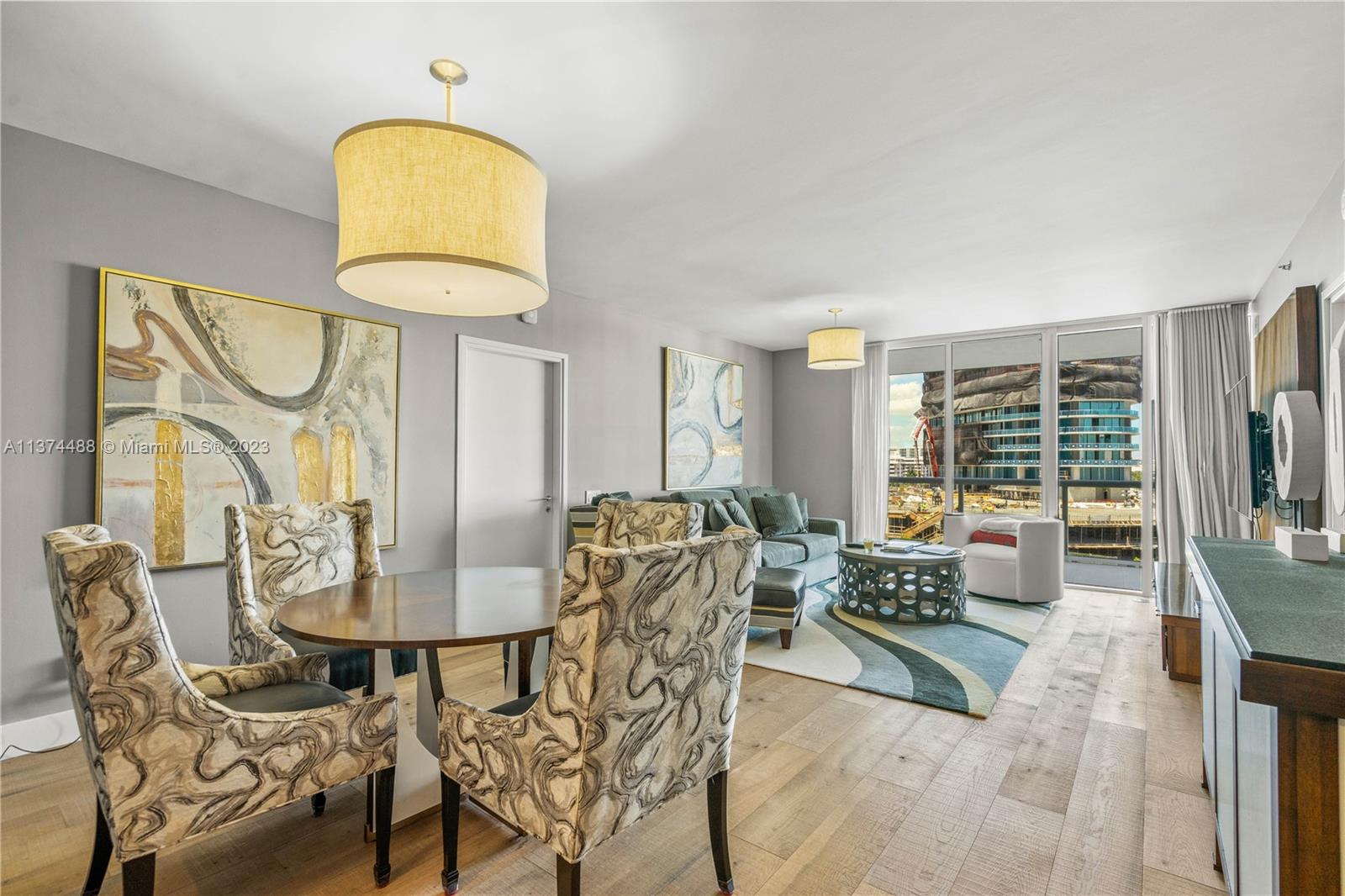 450 Alton Road, Unit 806 Miami Beach, FL 33139 - Photo 3 of 33 a dining room with furniture and a window