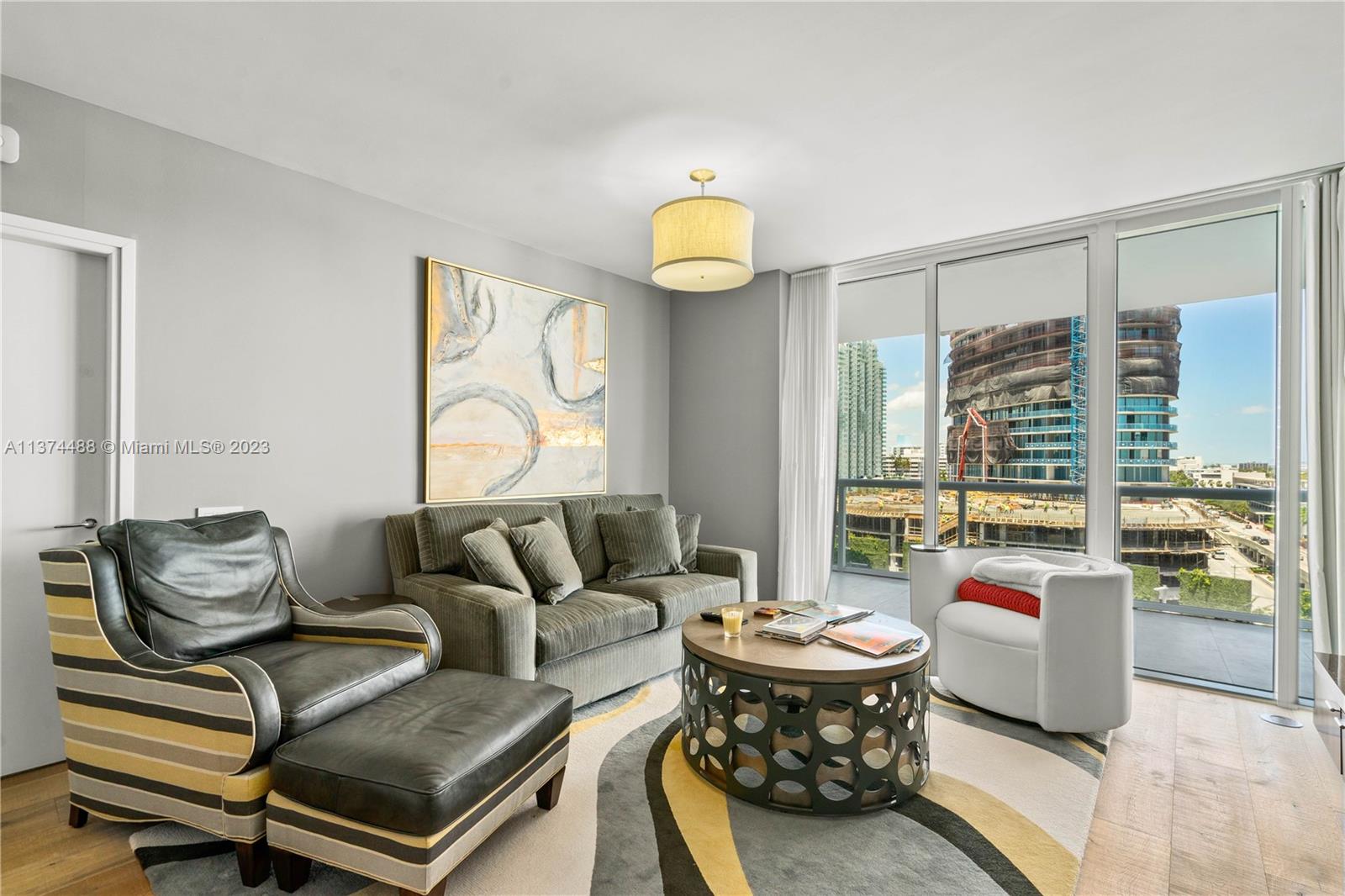 450 Alton Road, Unit 806 Miami Beach, FL 33139 - Photo 4 of 33 a living room with furniture and a large window