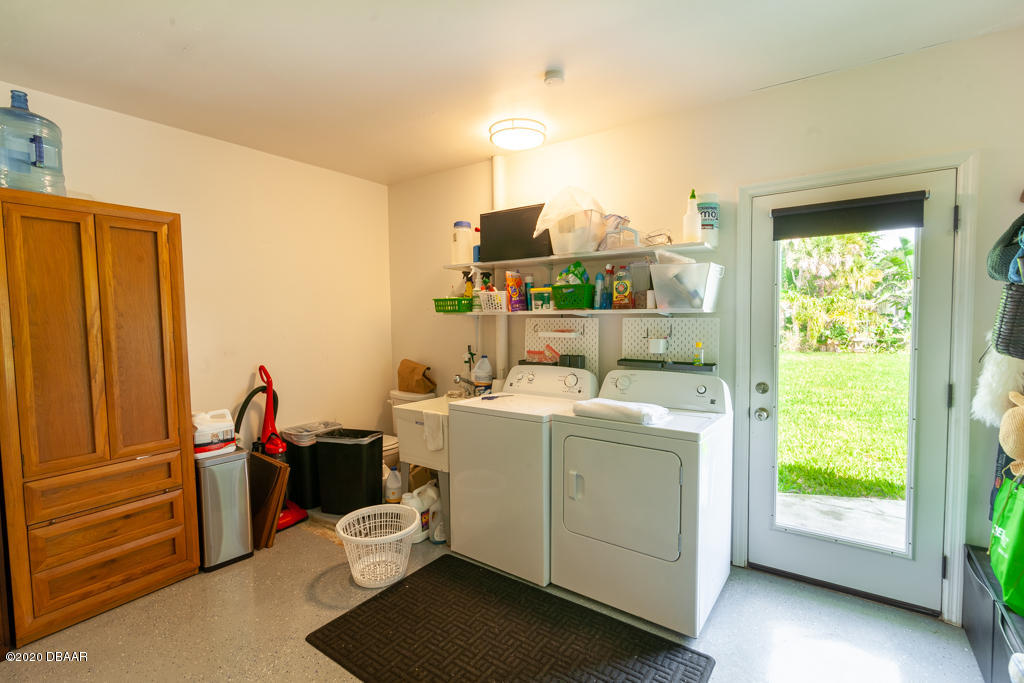 157 Flamingo Road Edgewater, FL 32141 - Photo 46 of 53 Laundry Area & Backyard Access