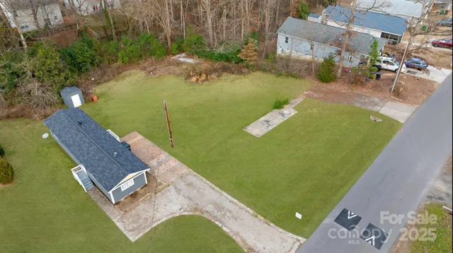 a view of a swimming pool with a yard