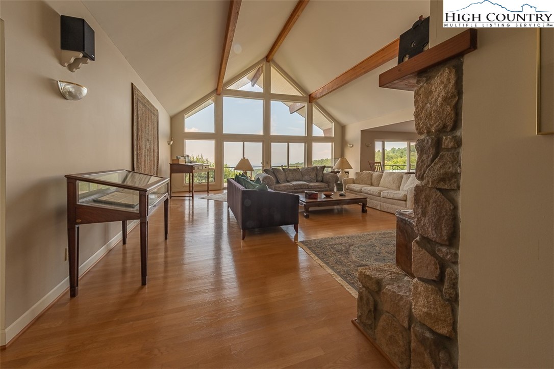 148 Chestnut Ridge Lane Glade Valley, NC 28627 - Photo 12 of 50 a lobby with furniture and floor to ceiling windows