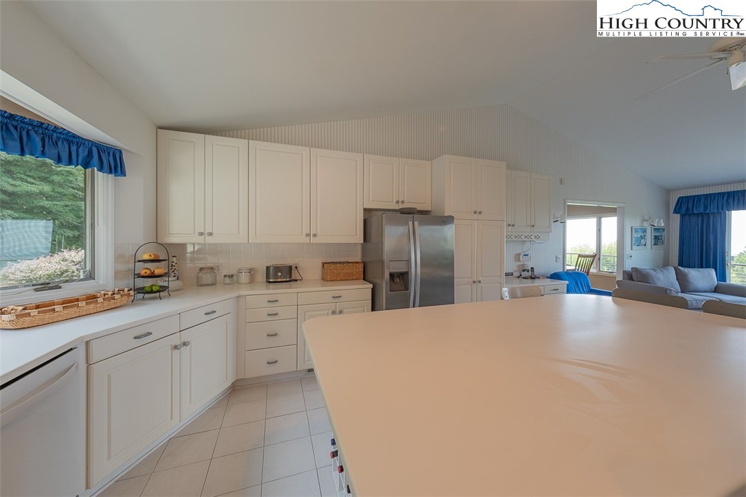 148 Chestnut Ridge Lane Glade Valley, NC 28627 - Photo 17 of 50 a kitchen with a cabinets and white appliances