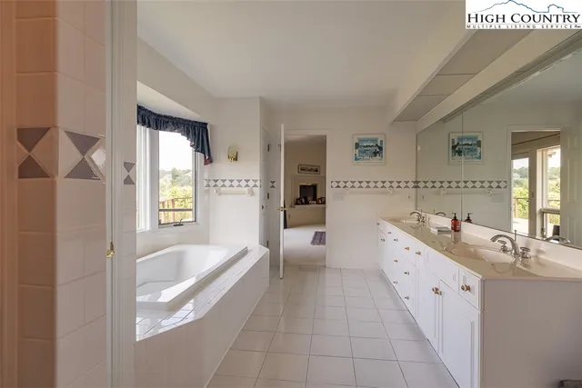 an aerial view of a house with garden space and street view