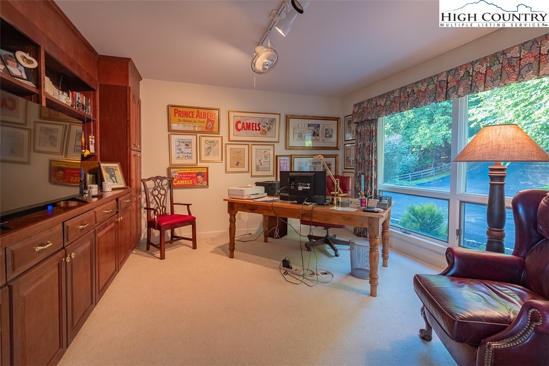 148 Chestnut Ridge Lane Glade Valley, NC 28627 - Photo 24 of 50 a view of a livingroom with furniture and a window