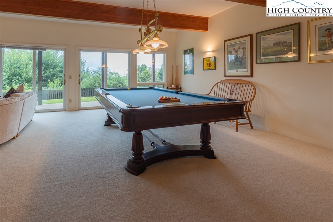 148 Chestnut Ridge Lane Glade Valley, NC 28627 - Photo 25 of 50 a living room with furniture a window and a table