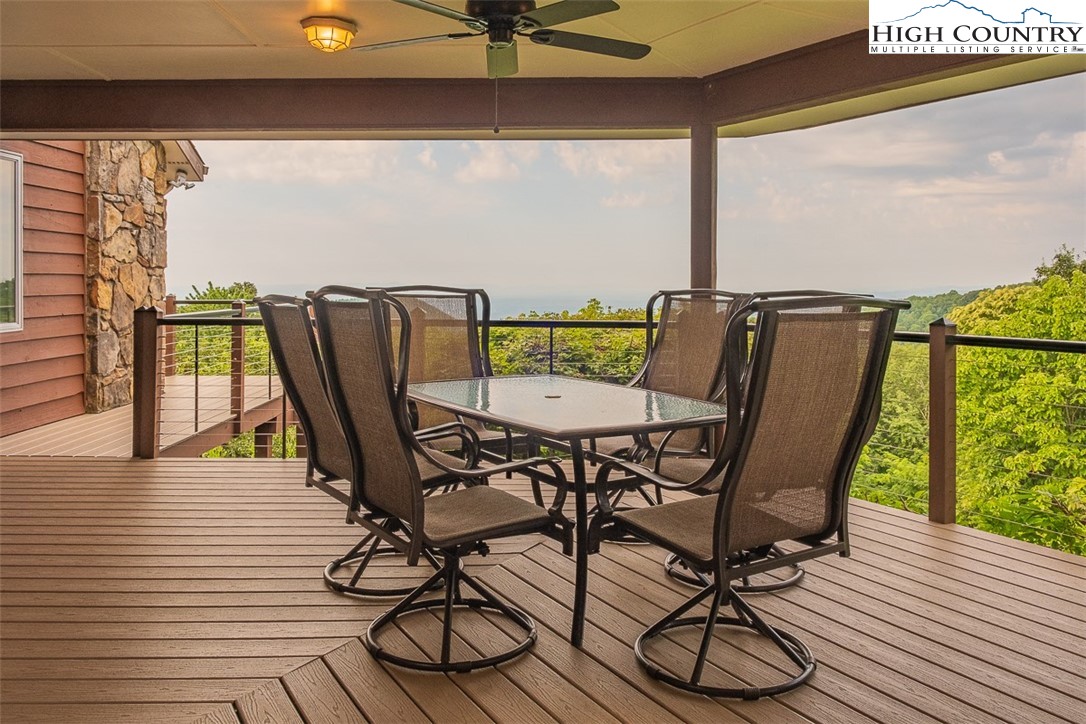 148 Chestnut Ridge Lane Glade Valley, NC 28627 - Photo 5 of 50 a view of a balcony with furniture and wooden floor
