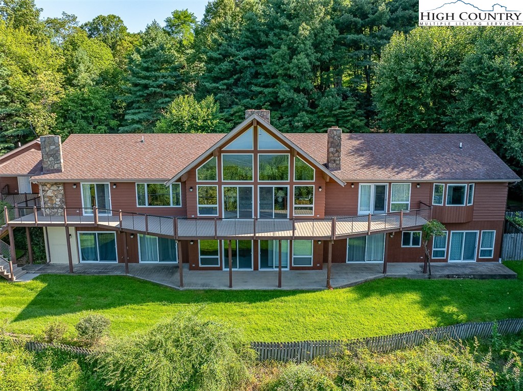 148 Chestnut Ridge Lane Glade Valley, NC 28627 - Photo 7 of 50 a view of house with garden
