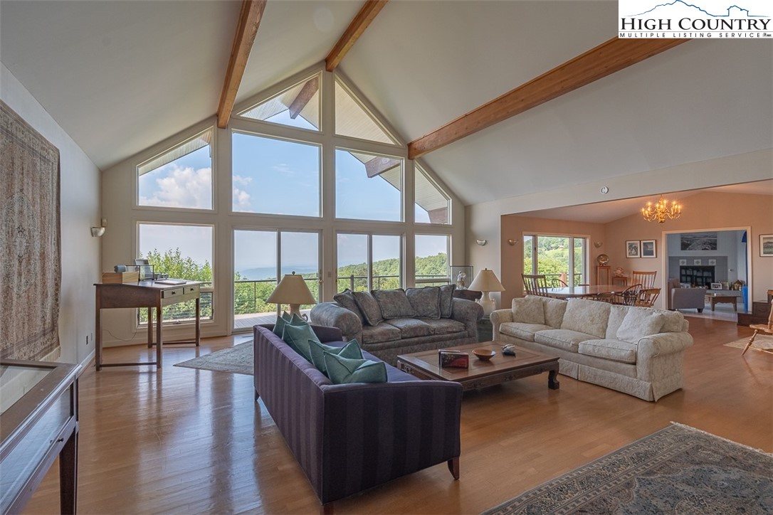 148 Chestnut Ridge Lane Glade Valley, NC 28627 - Photo 9 of 50 a living room with furniture and a large window