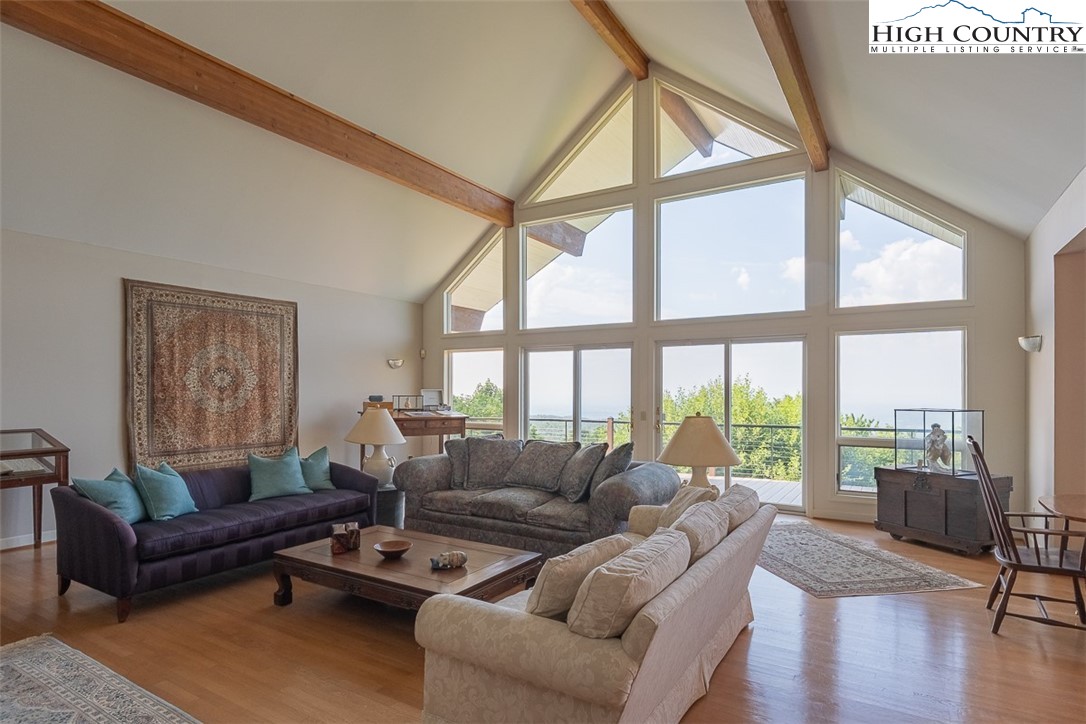 148 Chestnut Ridge Lane Glade Valley, NC 28627 - Photo 10 of 50 a living room with furniture and a large window