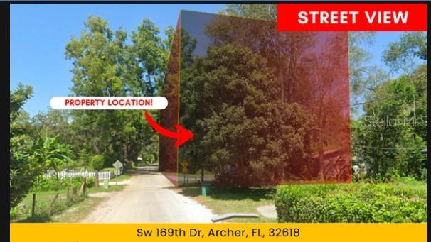 Southwest 169th Drive Archer, FL 32618 - Photo 2 of 8 a street sign that is sitting on a brick wall