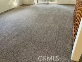 a room with washing machine and a window