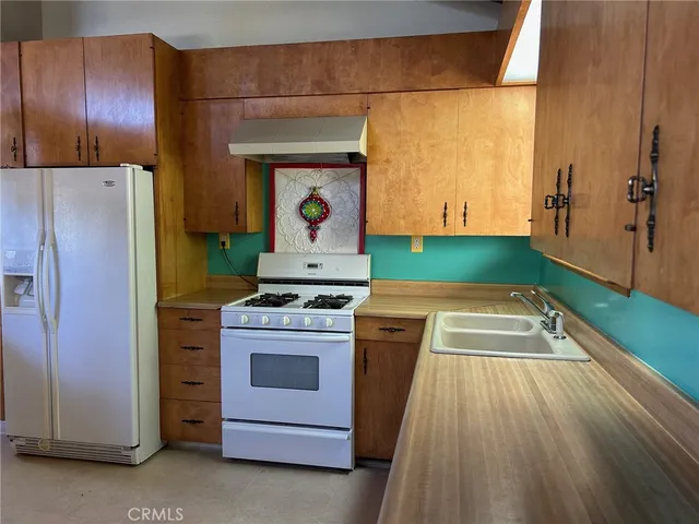 a view of a porch with furniture and floor to ceiling window