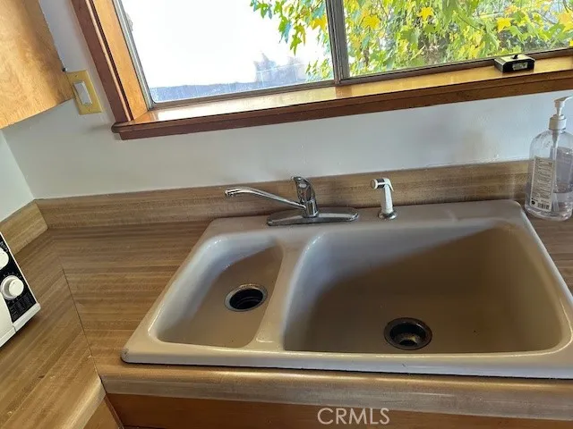 a view of a door and wooden bench