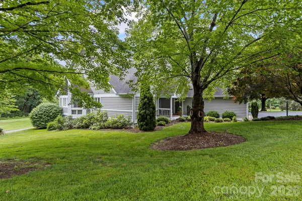 a house that is sitting in the grass