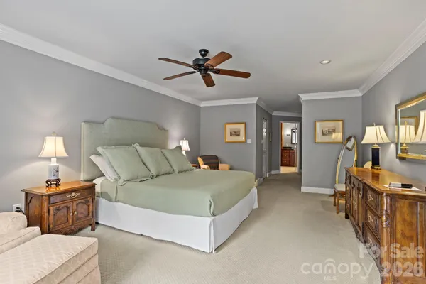 a living room with a bed and furniture