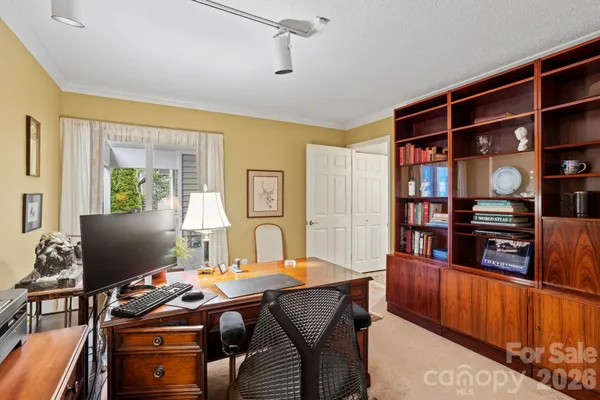 a view of a workspace with furniture