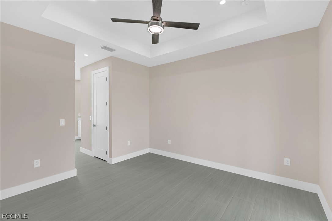 6029 Keystone Circle LaBelle, FL 33935 - Photo 31 of 50 an empty room with a ceiling fan and carpet