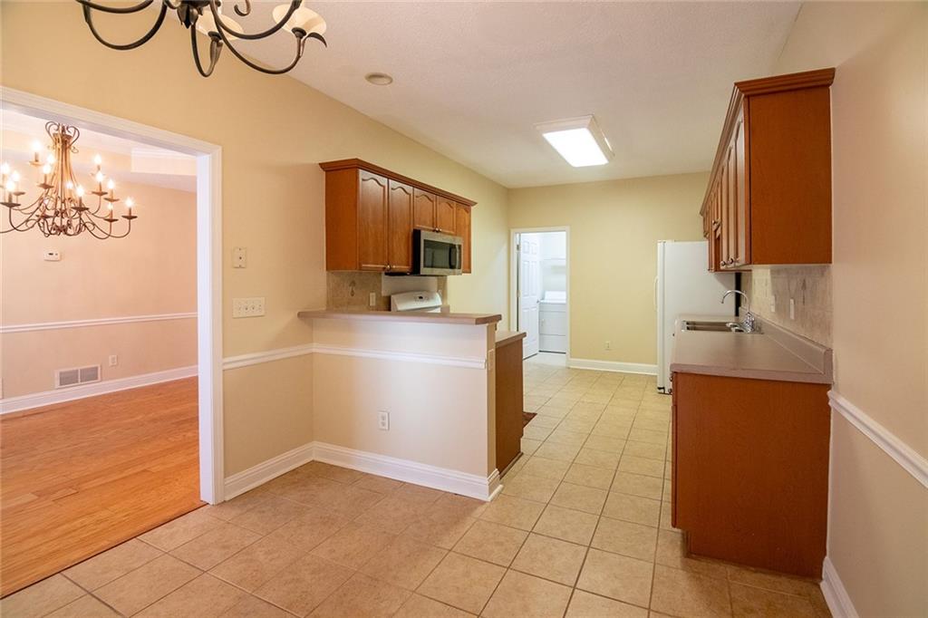 2545 Rosehill Circle Lithia Springs, GA 30122 - Photo 15 of 27 a kitchen with stainless steel appliances a refrigerator and a sink