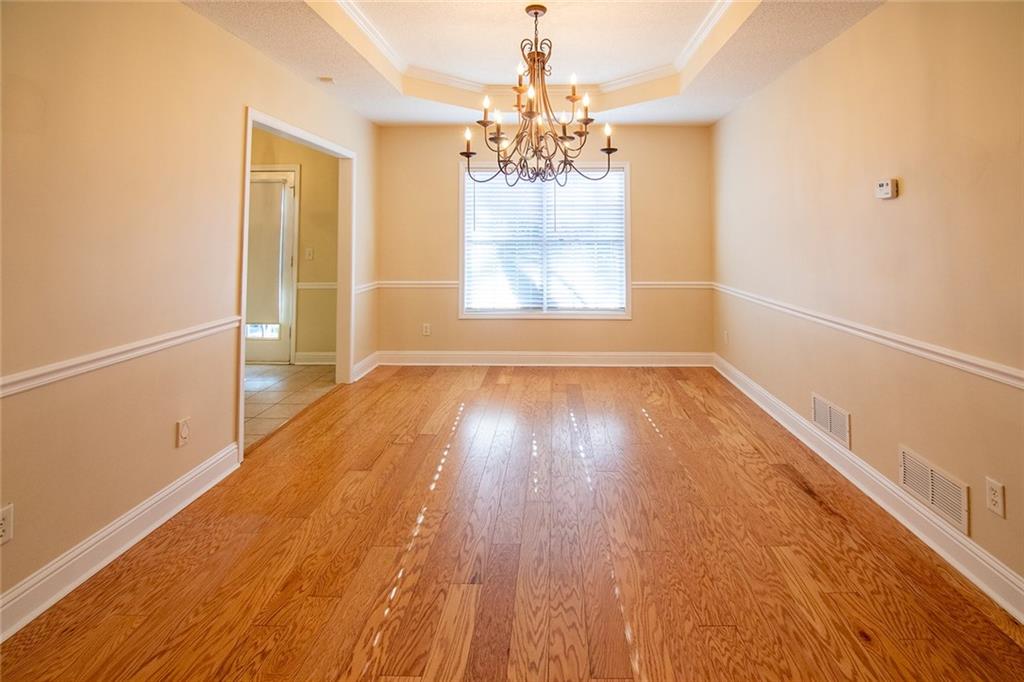 2545 Rosehill Circle Lithia Springs, GA 30122 - Photo 16 of 27 a view of a room with wooden floor and window
