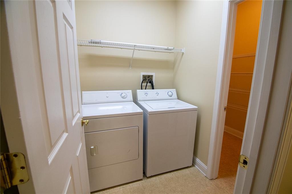 2545 Rosehill Circle Lithia Springs, GA 30122 - Photo 21 of 27 a utility room with dryer and washer