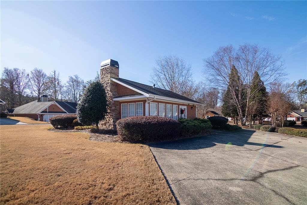 2545 Rosehill Circle Lithia Springs, GA 30122 - Photo 23 of 27 a view of a house with a yard covered in snow